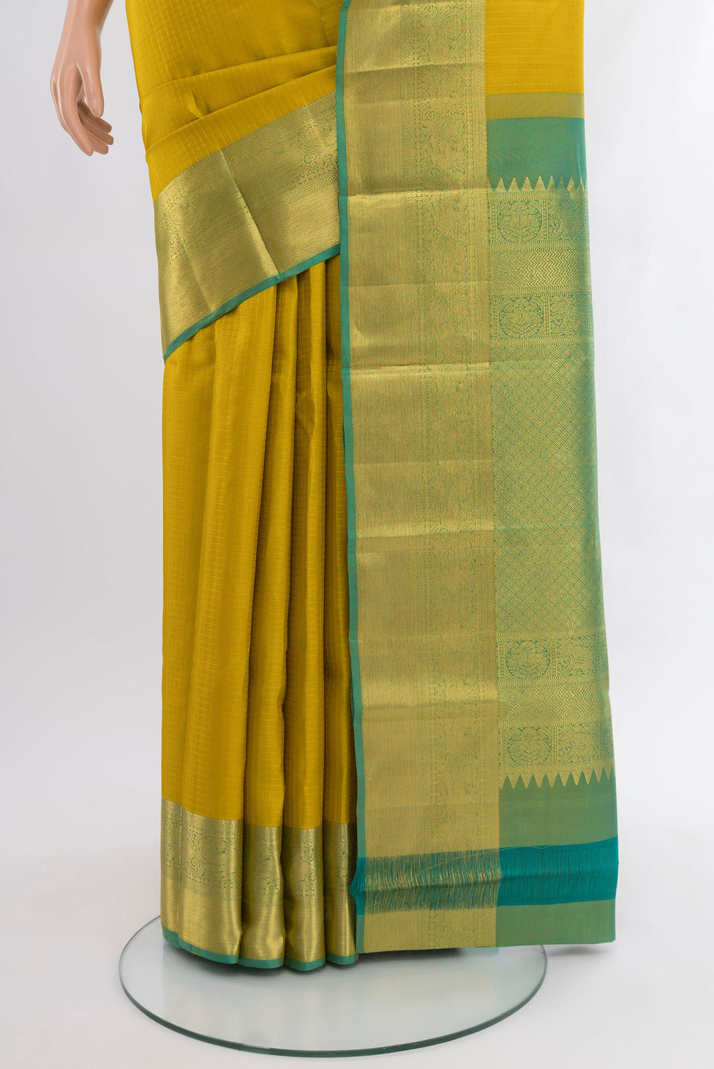 Pleats and pallu of Yellow Kanjivaram Silk Saree with Checked design on the body and Zari Border. 