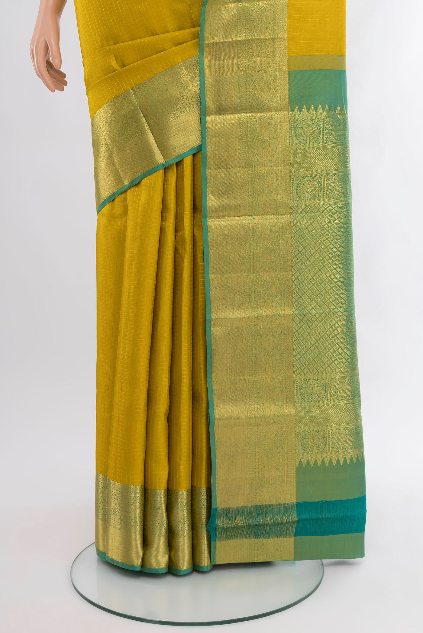 Pleats and pallu of Yellow Kanjivaram Silk Saree with Checked design on the body and Zari Border. 