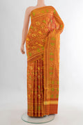 Pure Silk Orange Rajkot Patola Saree with Pure Ikat on the body and Ikat Border.  displayed on a mannequin