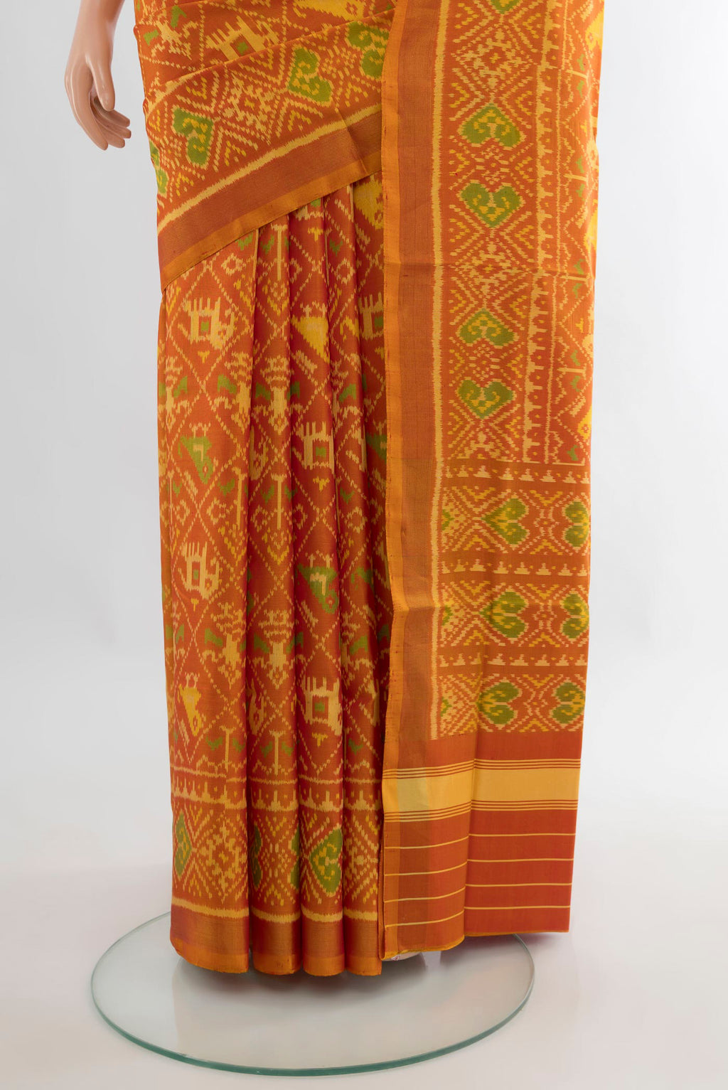 Pleats and pallu of Pure Silk Orange Rajkot Patola Saree with Pure Ikat on the body and Ikat Border. 