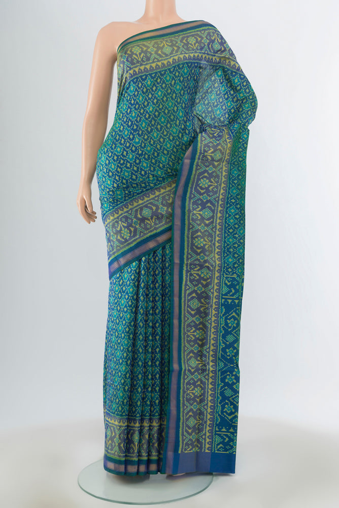 Multi Color Rajkot Patola Silk Saree with Ikat Print on the body and Silk Border.  displayed on a mannequin