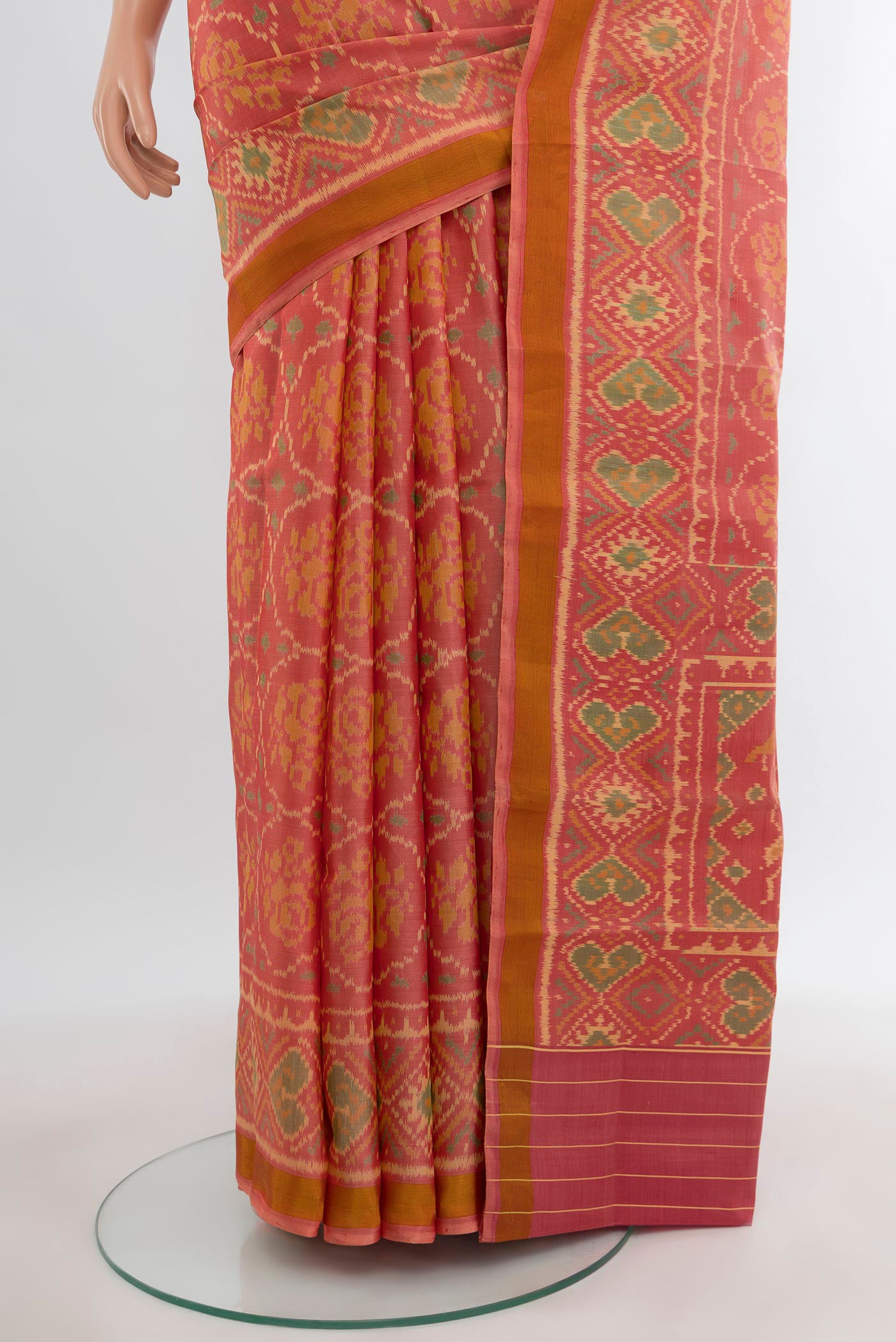Pleats and pallu of Orange Rajkot Patola Silk Saree with Pure Ikat on the body and Ikat Border. 