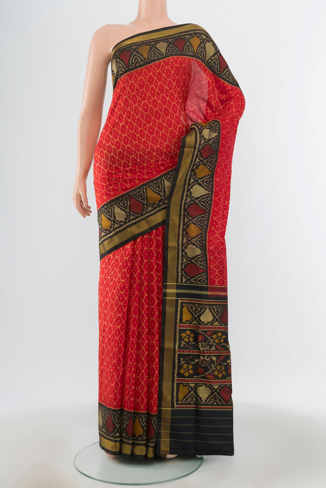 Multi Color Rajkot Patola Silk Saree with Ikat Print on the body and Silk Border.  displayed on a mannequin