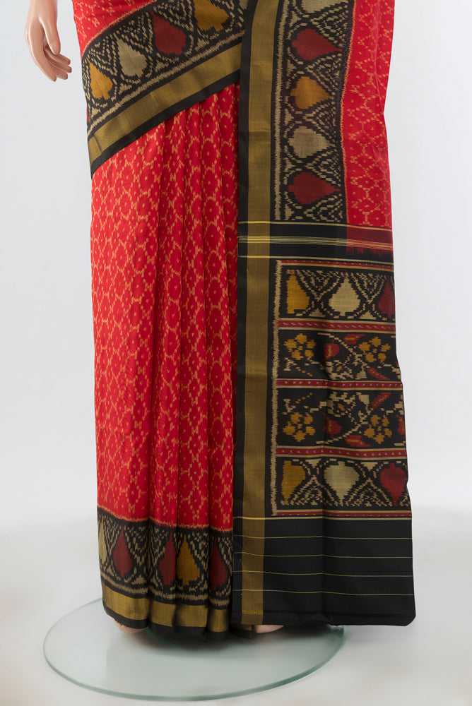 Pleats and pallu of Multi Color Rajkot Patola Silk Saree with Ikat Print on the body and Silk Border. 