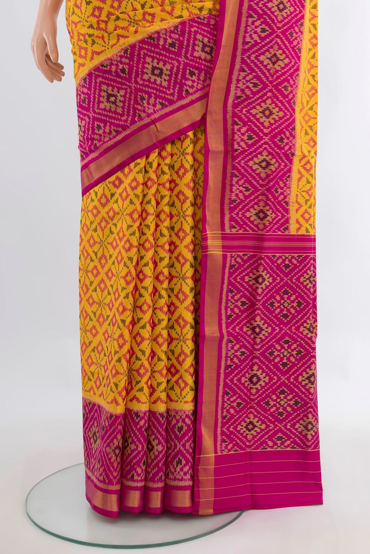 Pleats and pallu of Pure Silk Yellow Rajkot Patola Saree with Pure Ikat on the body and Ikat Border. 