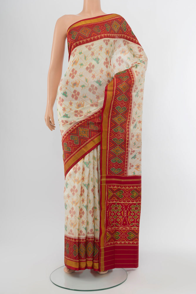 Multi Color Rajkot Patola Silk Saree with Ikat Print on the body and Silk Border.  displayed on a mannequin