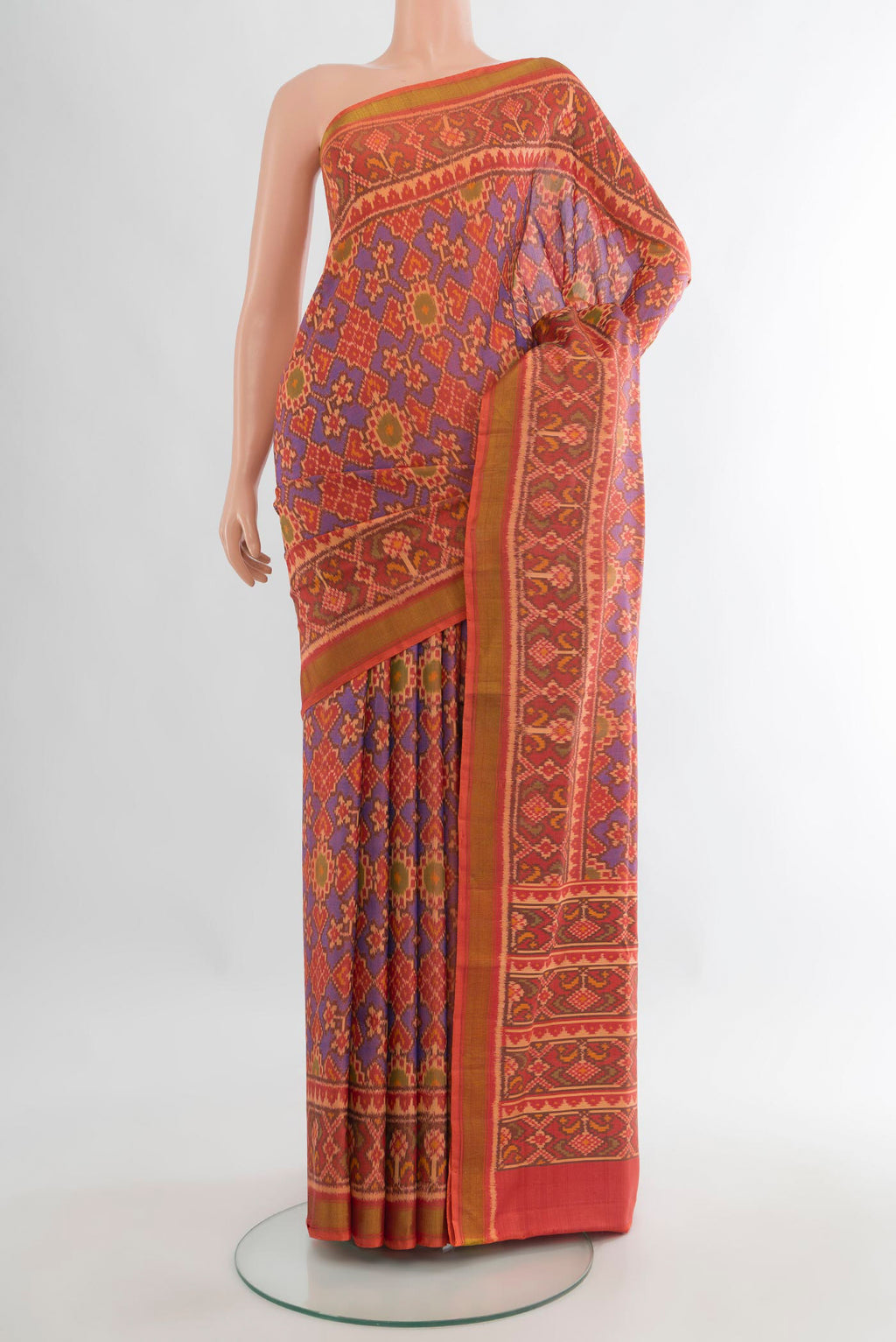 Pure Silk Multi Color Rajkot Patola Saree with Pure Ikat on the body and Ikat Border.  displayed on a mannequin