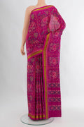 Magenta Rajkot Patola Silk Saree with Pure Ikat on the body and Zari Border.  displayed on a mannequin