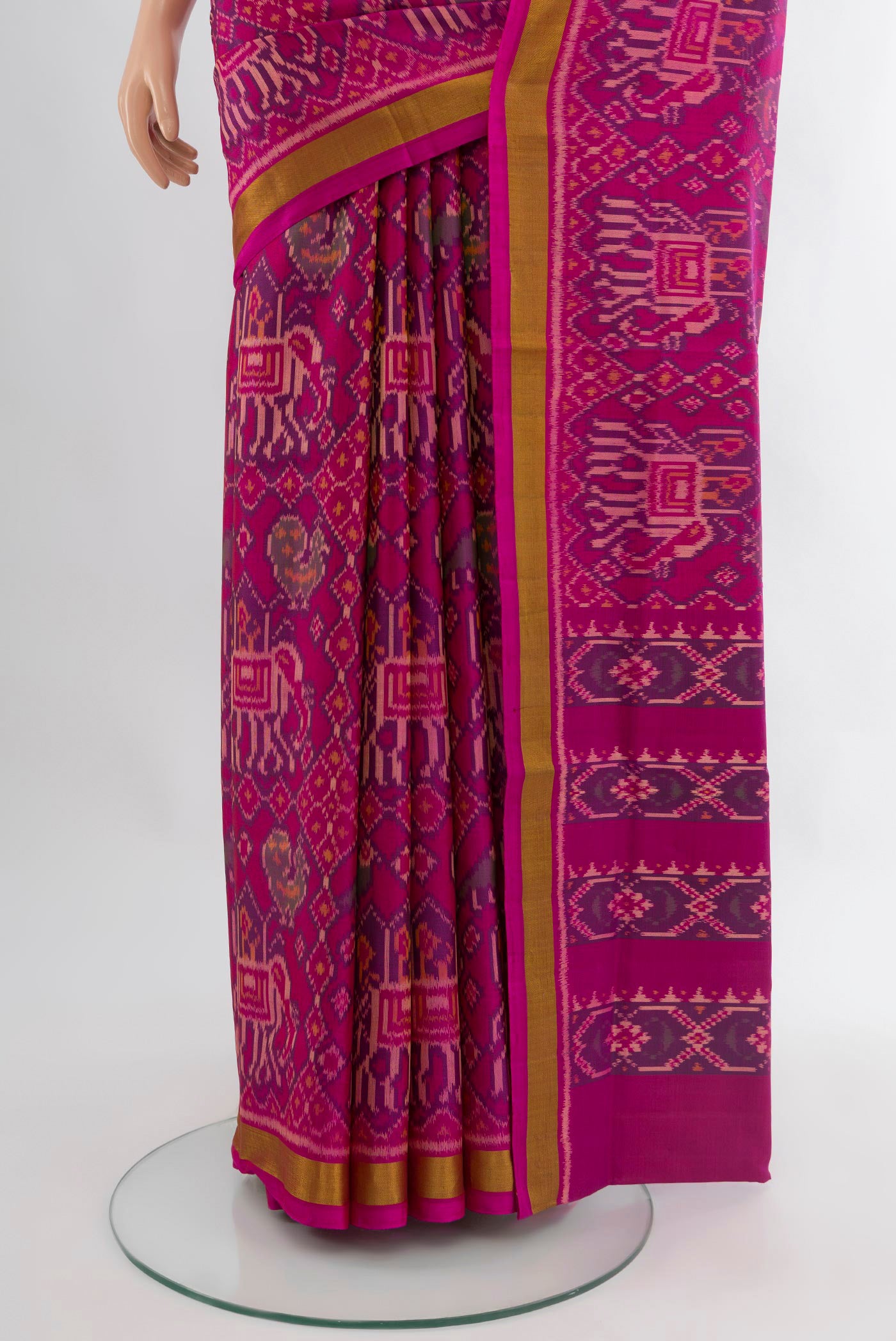 Pleats and pallu of Magenta Rajkot Patola Silk Saree with Pure Ikat on the body and Zari Border. 