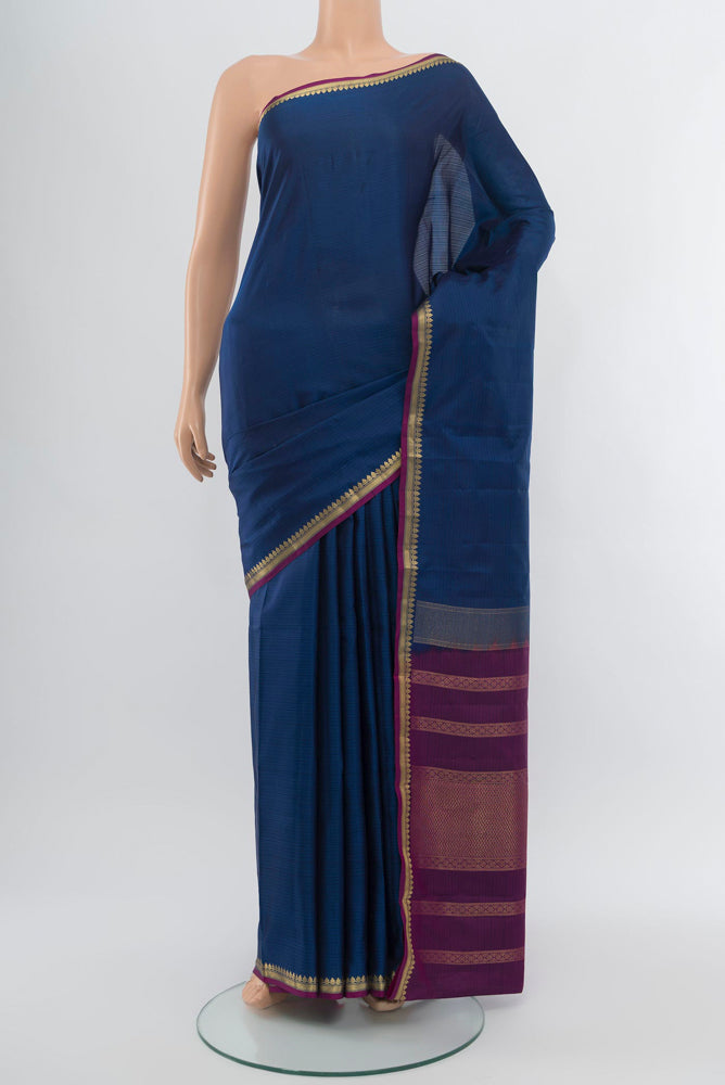 Dark Blue Soft Silk Saree with Zari Butta on the body and Silk Border.  displayed on a mannequin