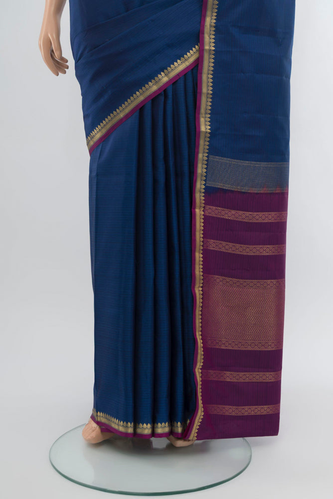 Pleats and pallu of Dark Blue Soft Silk Saree with Zari Butta on the body and Silk Border. 