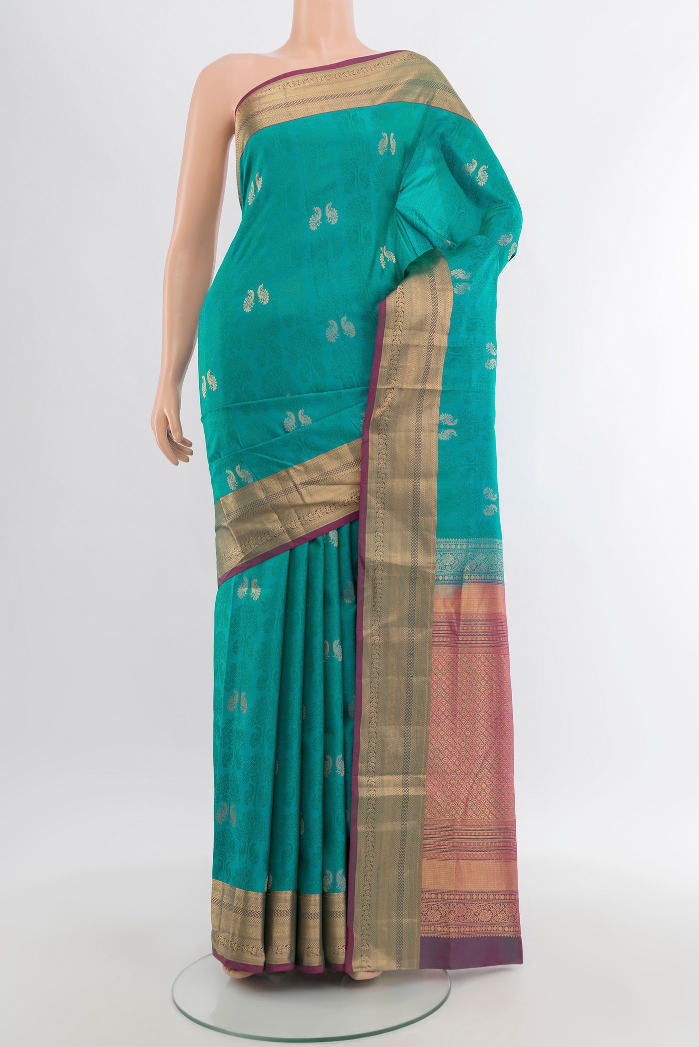 Turquoise Soft Silk Saree with Jacquard With Zari Butta on the body and Zari Border.  displayed on a mannequin