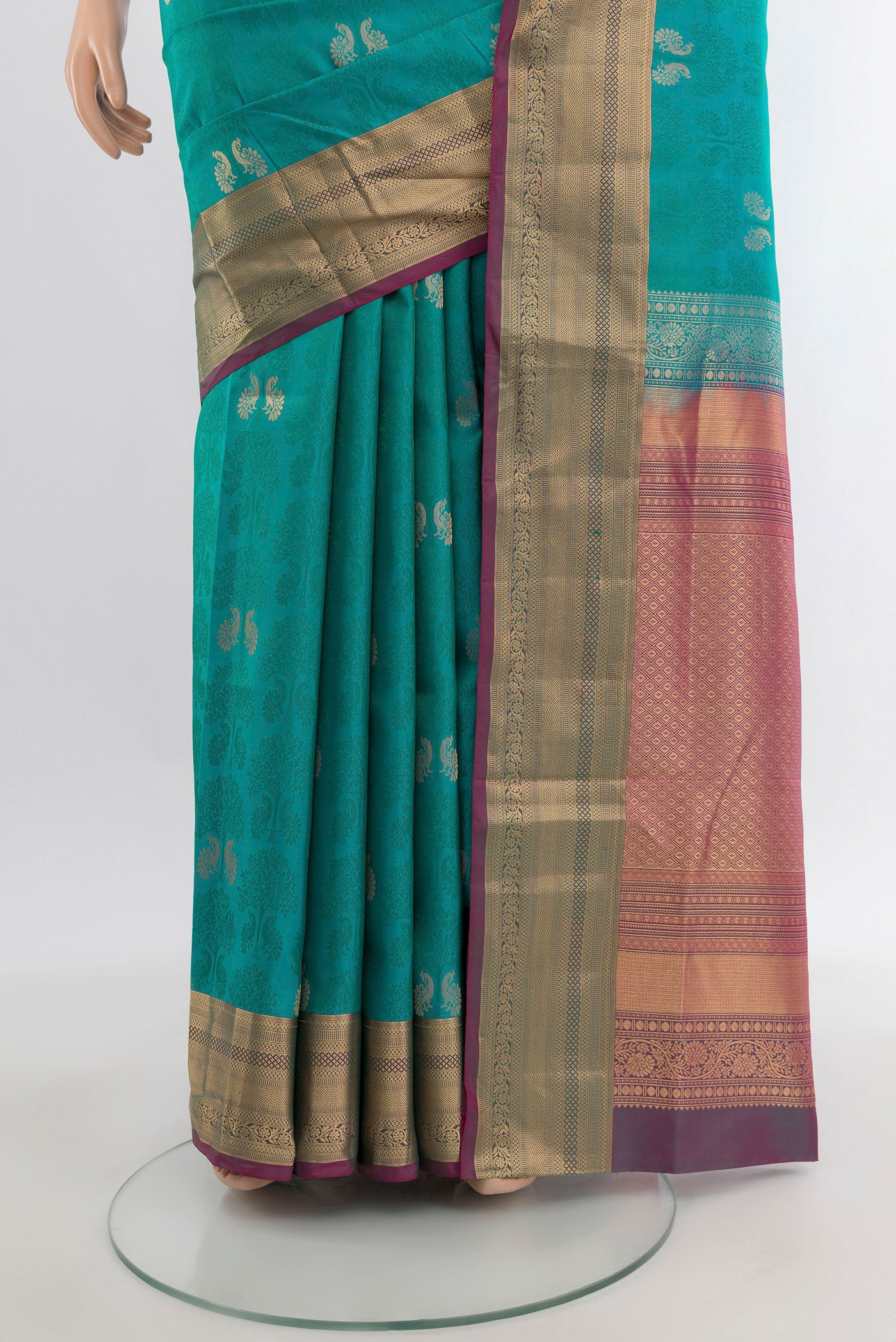 Pleats and pallu of Turquoise Soft Silk Saree with Jacquard With Zari Butta on the body and Zari Border. 
