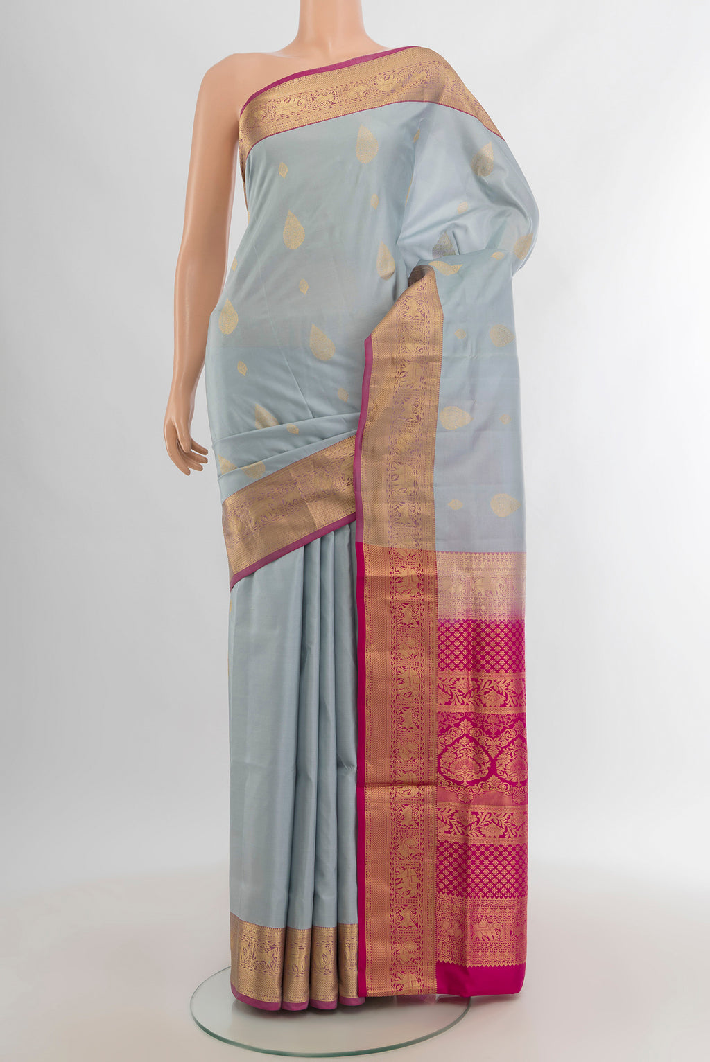 Grey Soft Silk Saree with Zari Butta on the body and Zari Border.  displayed on a mannequin