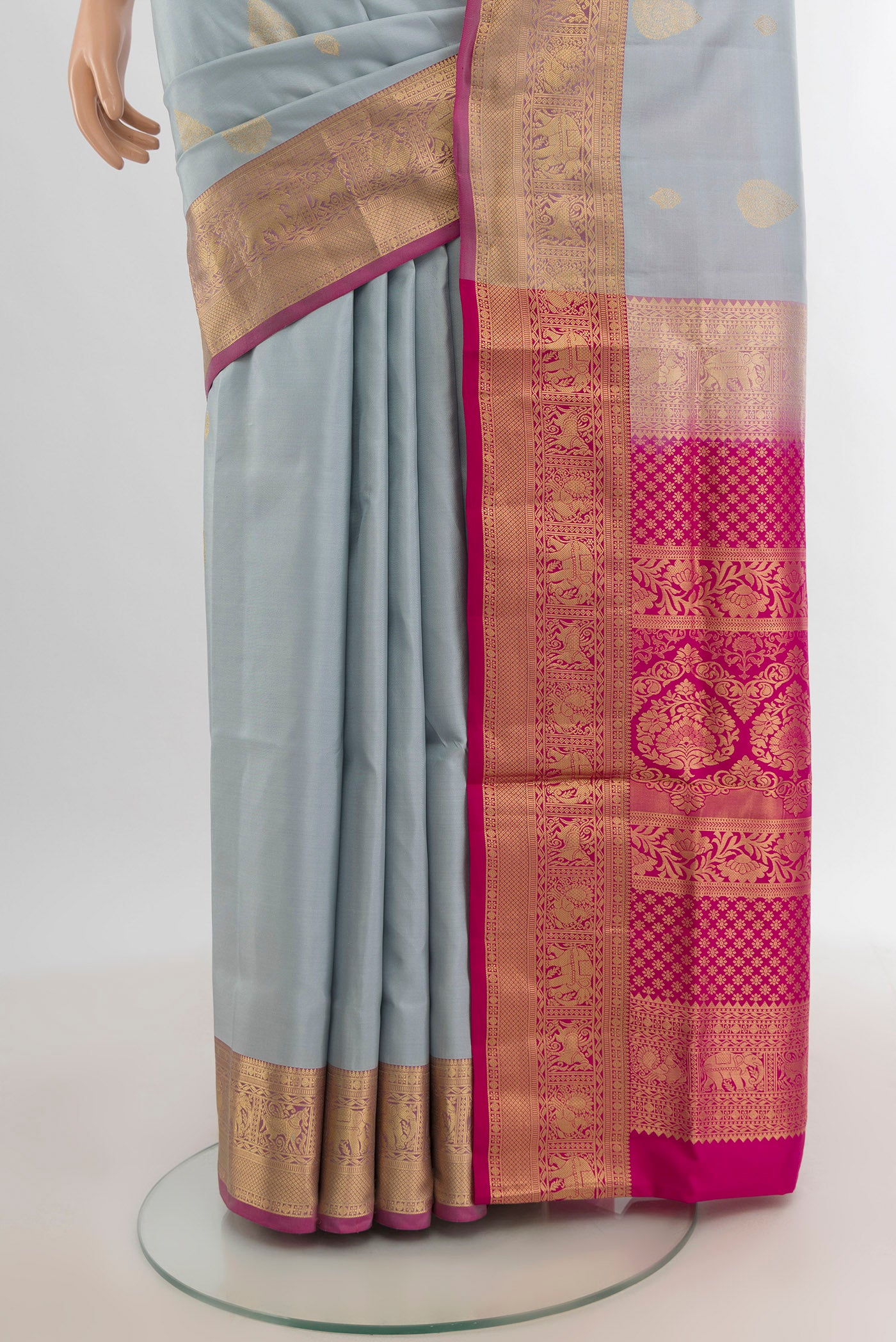 Pleats and pallu of Grey Soft Silk Saree with Zari Butta on the body and Zari Border. 