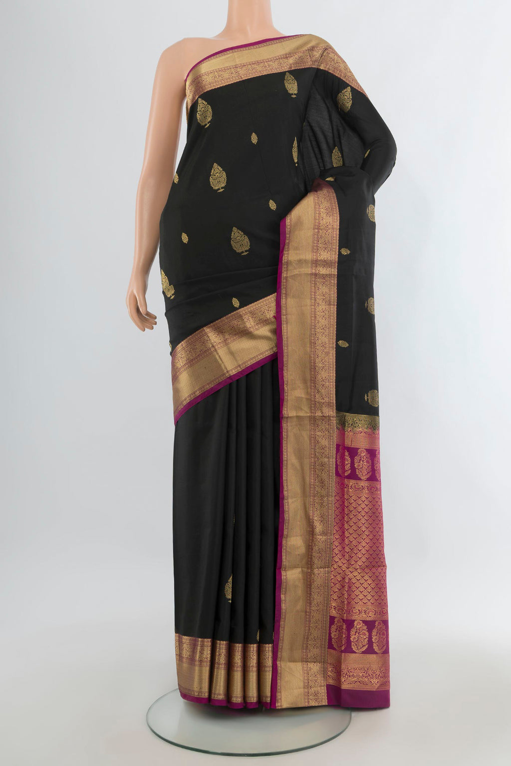 Pure Silk Black Soft Saree with Zari Butta on the body and Zari Border.  displayed on a mannequin