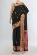 Pure Silk Black Soft Saree with Zari Butta on the body and Zari Border.  displayed on a mannequin