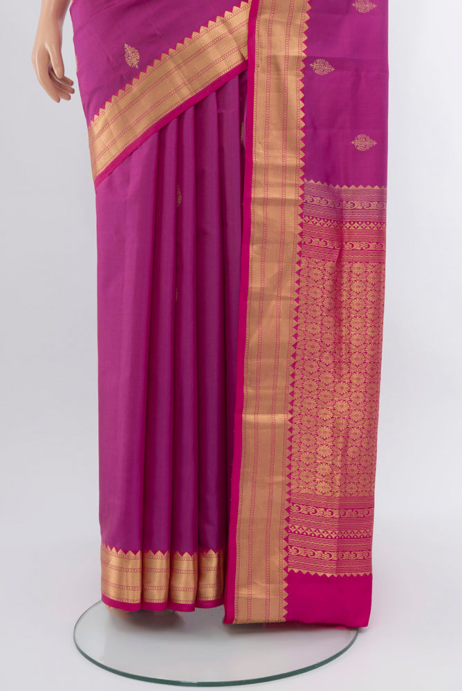 Pleats and pallu of Purple Kanchipuram Silk Saree with Zari Brocade on the body and Silk Border. 