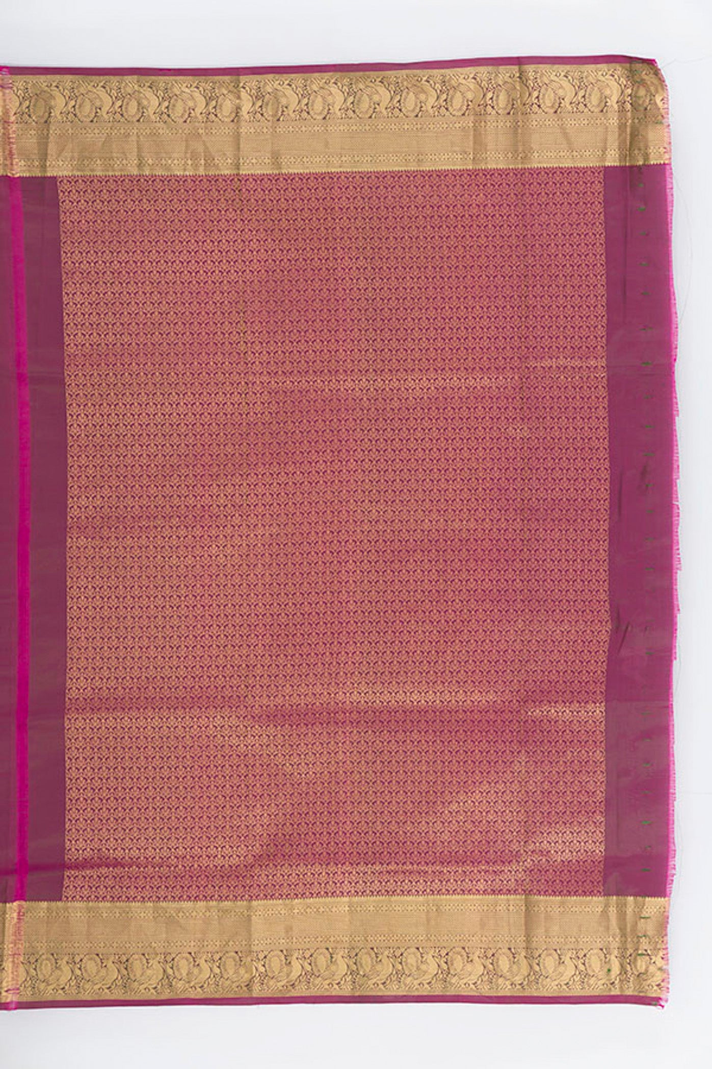 Close up image of the blouse of Mint Green Soft Silk Saree with Zari Butta on the body and Silk Border. 
