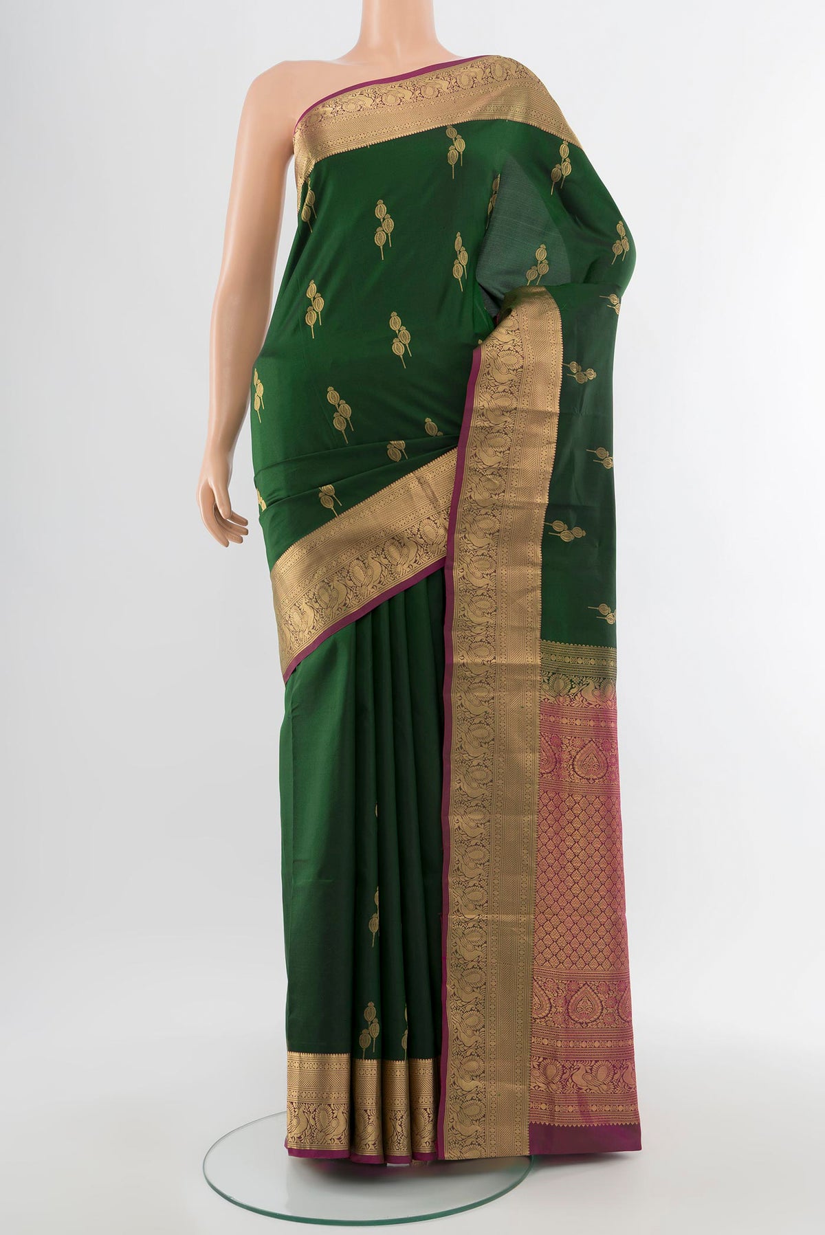 Mint Green Soft Silk Saree with Zari Butta on the body and Silk Border.  displayed on a mannequin