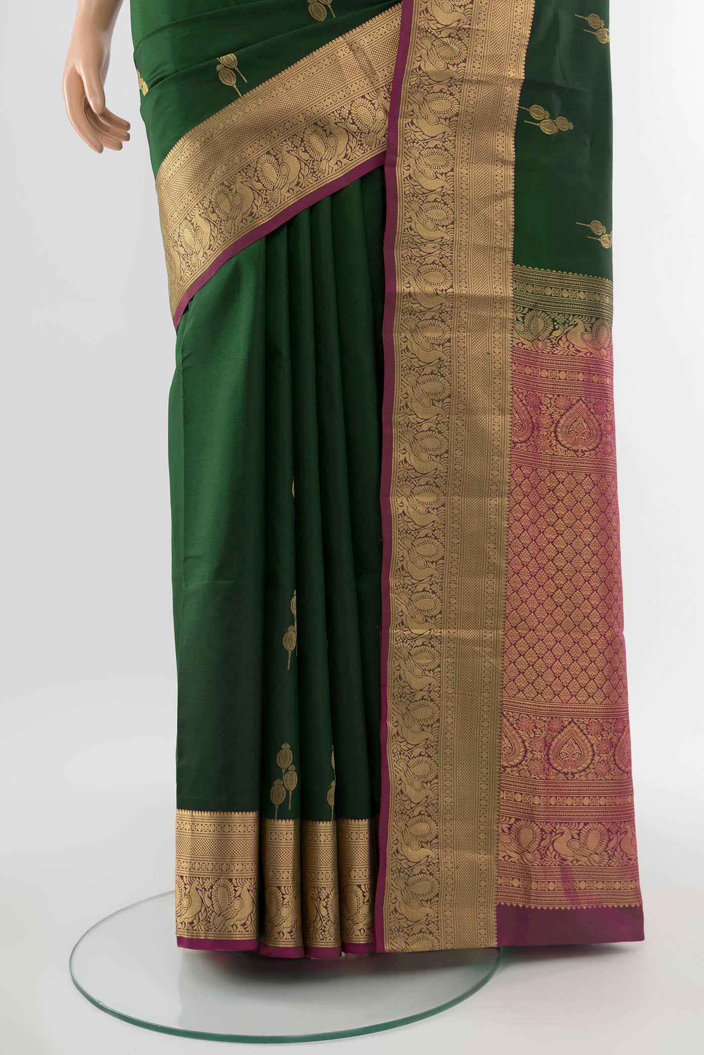 Pleats and pallu of Mint Green Soft Silk Saree with Zari Butta on the body and Silk Border. 