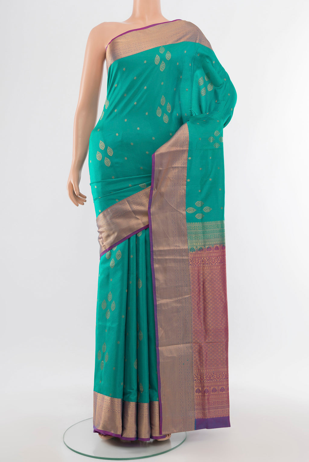 Light Blue Soft Silk Saree with Zari Butta on the body and Silk Border.  displayed on a mannequin
