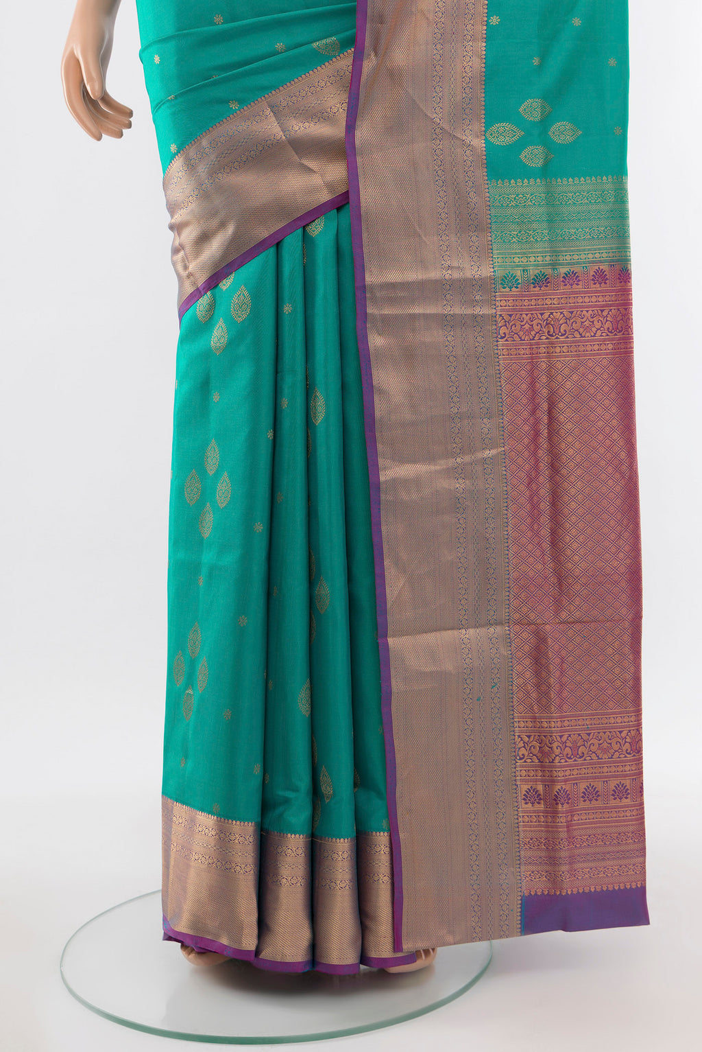 Pleats and pallu of Light Blue Soft Silk Saree with Zari Butta on the body and Silk Border. 