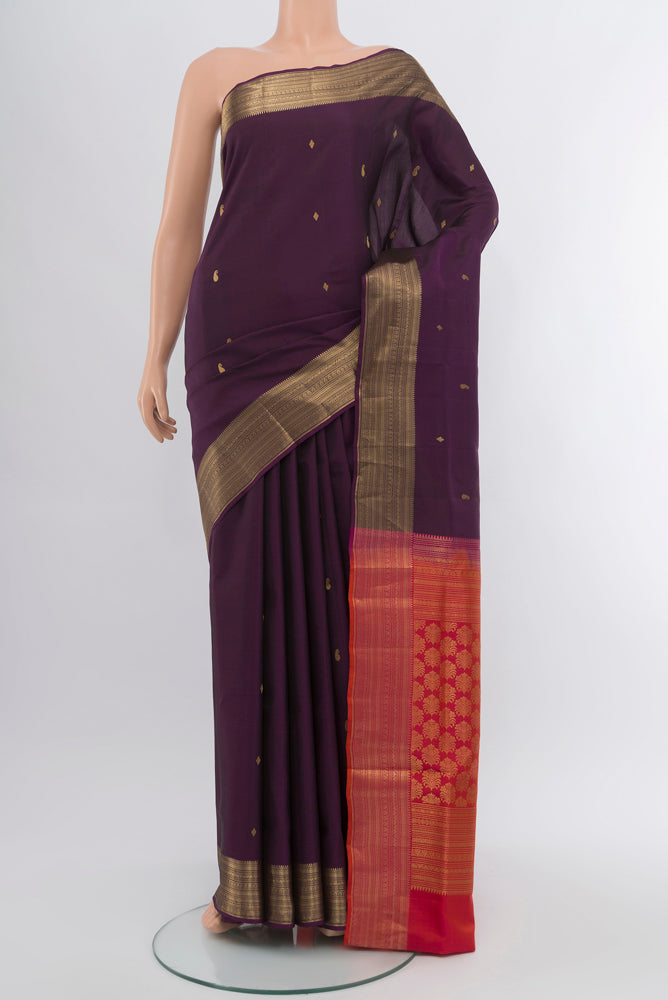 Violet Soft Silk Saree with Zari Butta on the body and Silk Border.  displayed on a mannequin