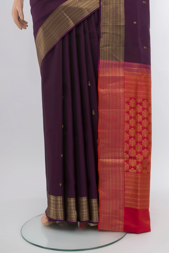 Pleats and pallu of Violet Soft Silk Saree with Zari Butta on the body and Silk Border. 