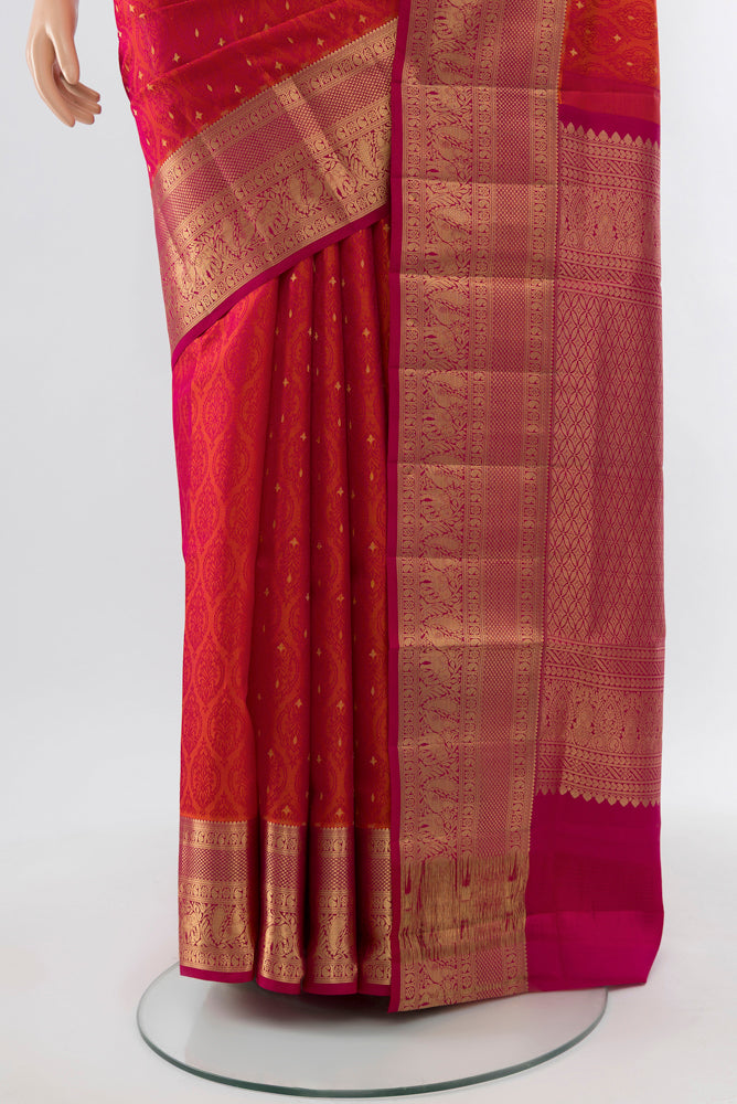Pleats and pallu of Dark Pink Soft Silk Saree with Zari Butta on the body and Silk Border. 