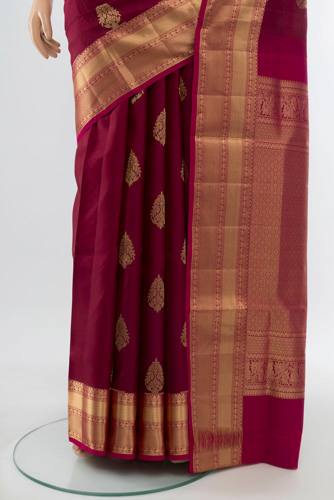 Pleats and pallu of Maroon Soft Silk Saree with Zari Brocade on the body and Silk Border. 