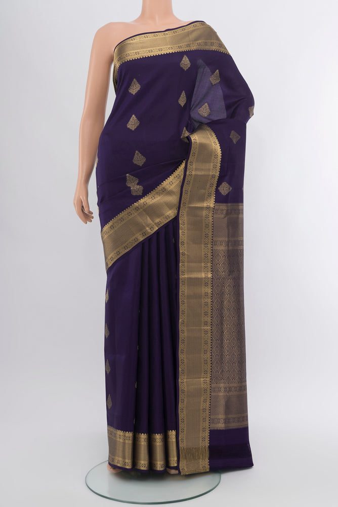 Navy Blue Soft Silk Saree with Zari Butta on the body and Silk Border.  displayed on a mannequin