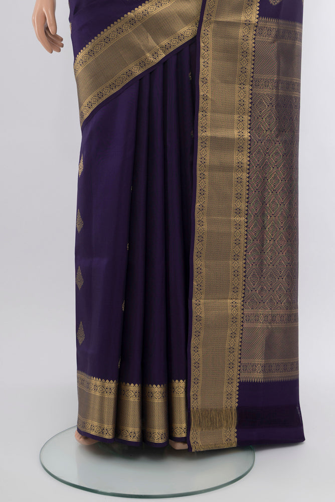 Pleats and pallu of Navy Blue Soft Silk Saree with Zari Butta on the body and Silk Border. 