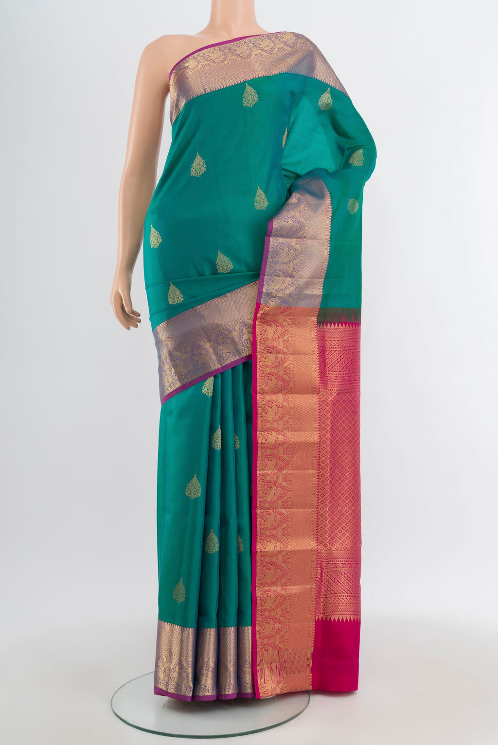 Light Blue Kanchipuram Silk Saree with Zari Butta on the body and Zari Border.  displayed on a mannequin