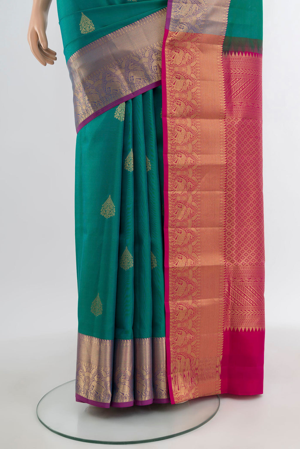 Pleats and pallu of Light Blue Kanchipuram Silk Saree with Zari Butta on the body and Zari Border. 