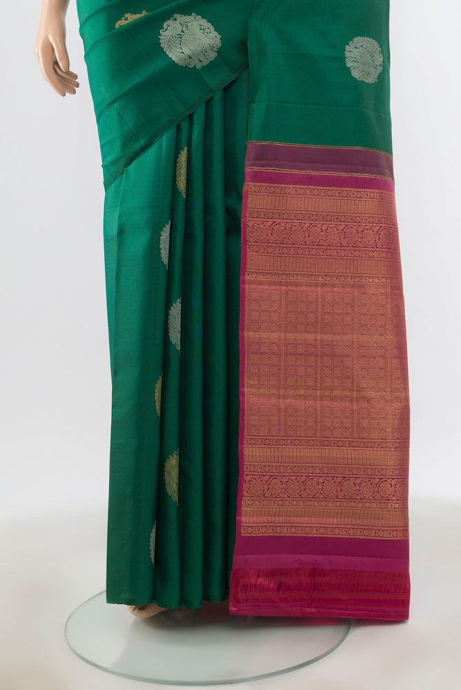 Pleats and pallu of Peacock Blue Kanchipuram Silk Saree with Zari Brocade on the body and Silk Border. 