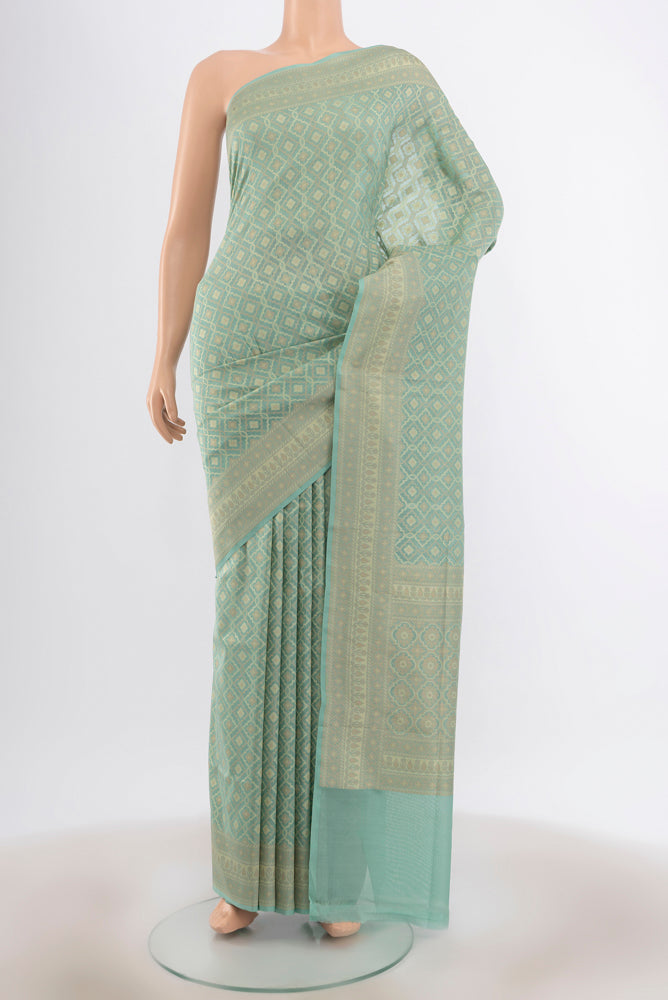 Sky Blue Banarasi Silk Saree with Zari Butta on the body and Silk Border.  displayed on a mannequin