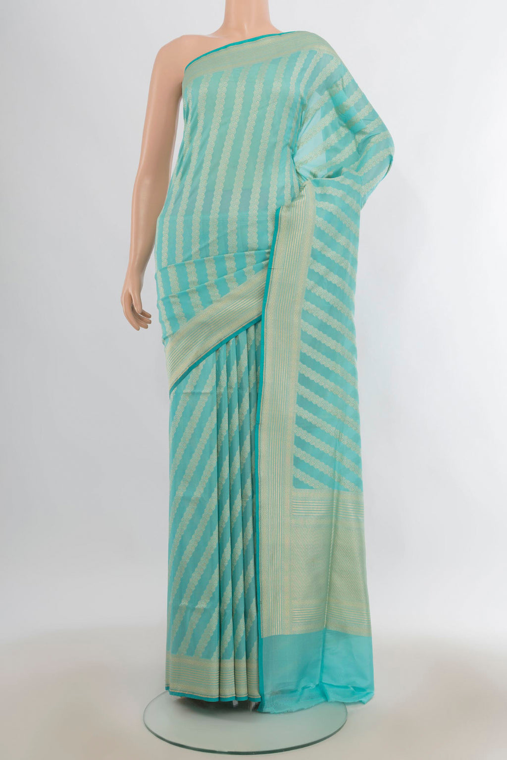 Pure Silk Light Blue Banarasi Saree with Stripes on the body and Zari Border.  displayed on a mannequin