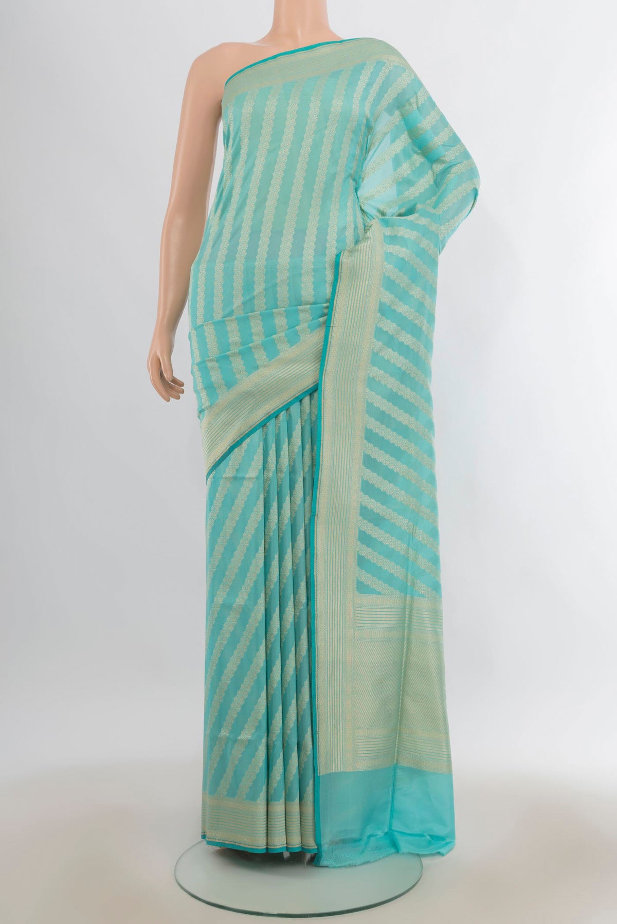 Pure Silk Light Blue Banarasi Saree with Stripes on the body and Zari Border.  displayed on a mannequin