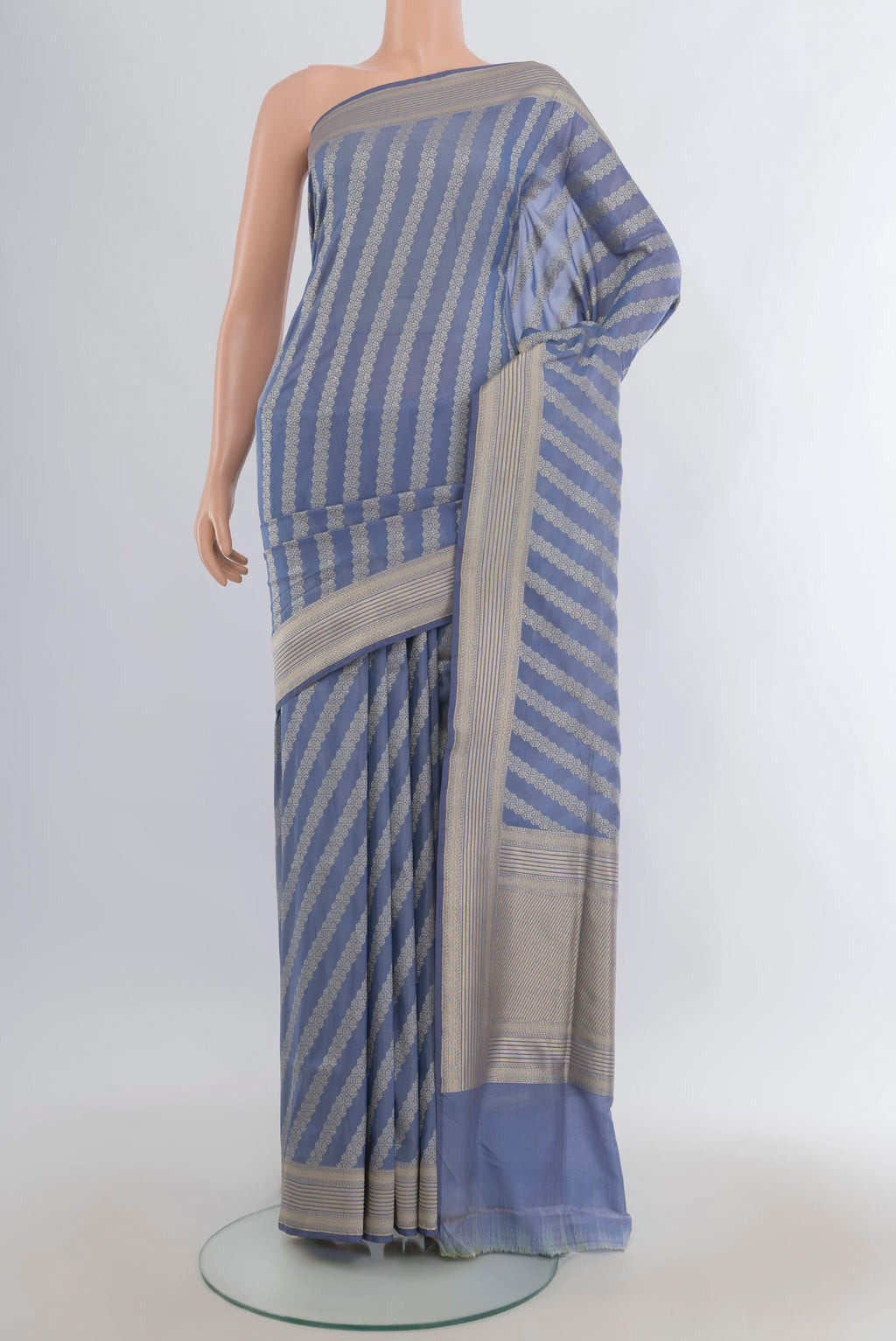 Pure Silk Light Blue Banarasi Saree with Zari Butta on the body and Zari Border.  displayed on a mannequin