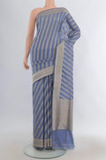 Pure Silk Light Blue Banarasi Saree with Zari Butta on the body and Zari Border.  displayed on a mannequin