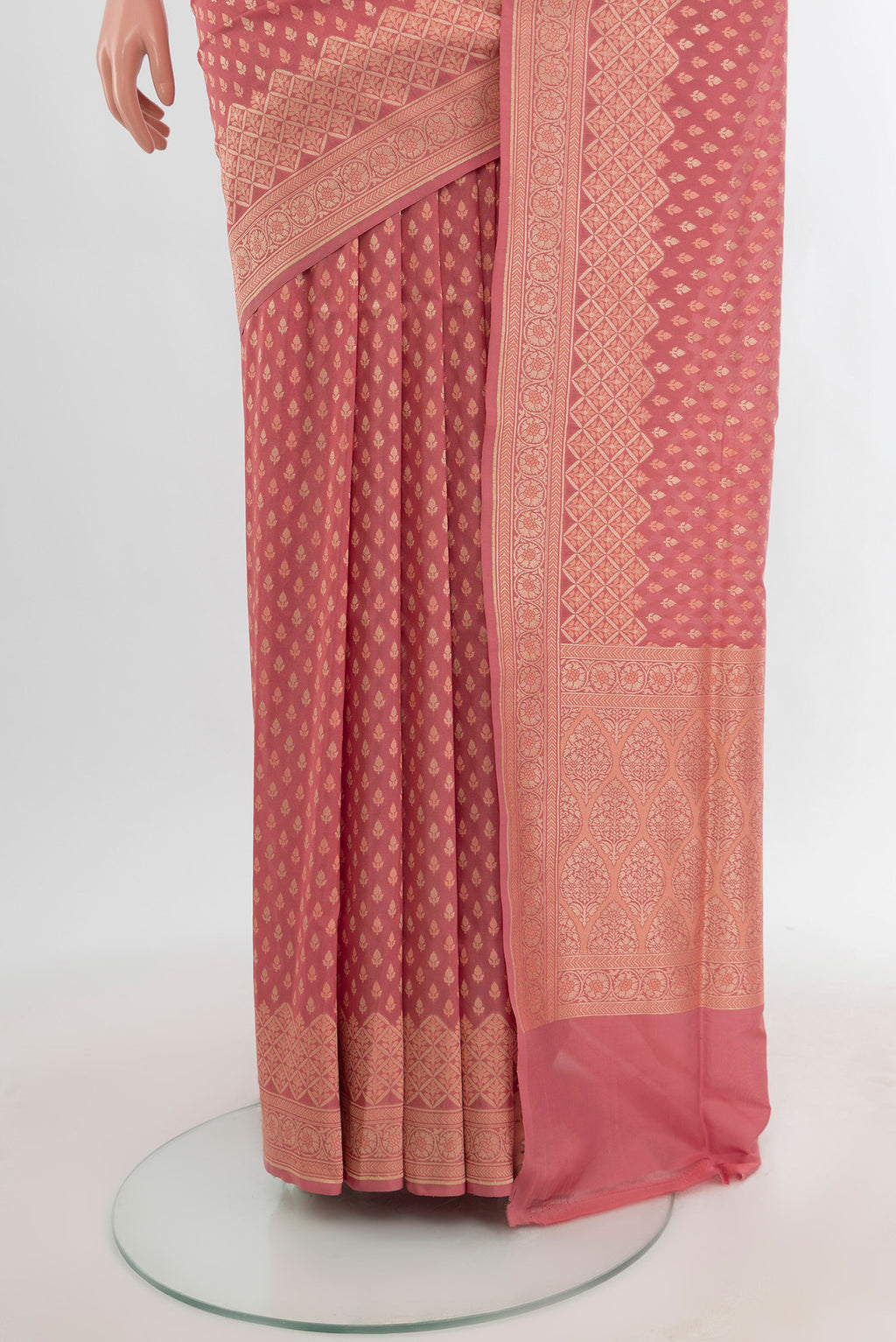 Pleats and pallu of Rose pink Banarasi Silk Saree with Zari Butta on the body and Zari Border. 