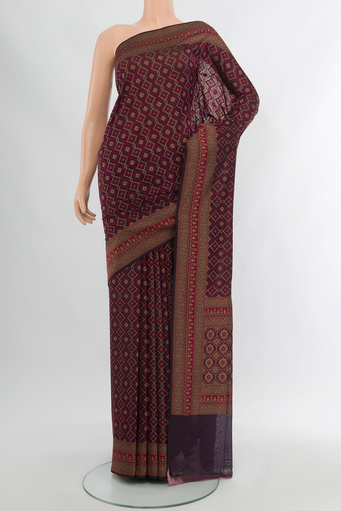 Brown Banarasi Silk Saree with Zari And Thread Butta on the body and Zari Border.  displayed on a mannequin