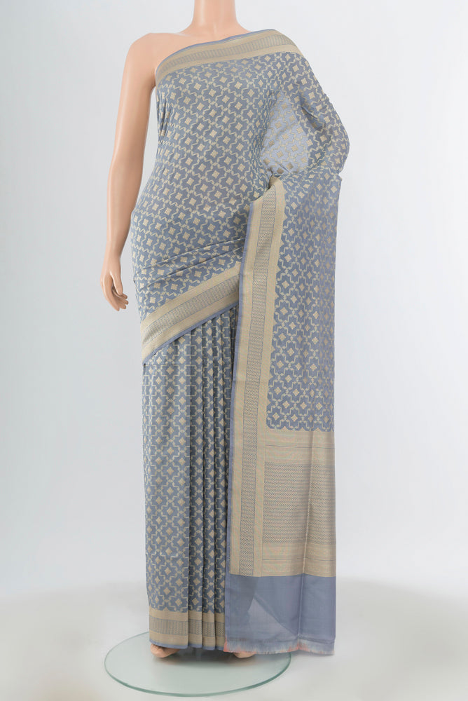 Davys Grey Banarasi Silk Saree with Zari Butta on the body and Silk Border.  displayed on a mannequin