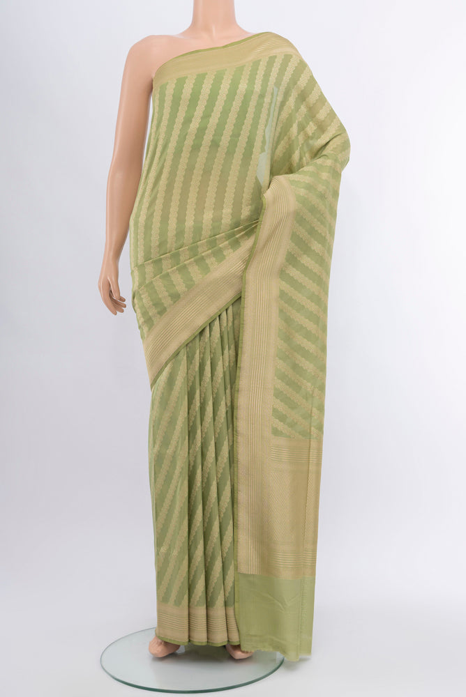 Pista Green Banarasi Silk Saree with Zari Butta on the body and Silk Border.  displayed on a mannequin