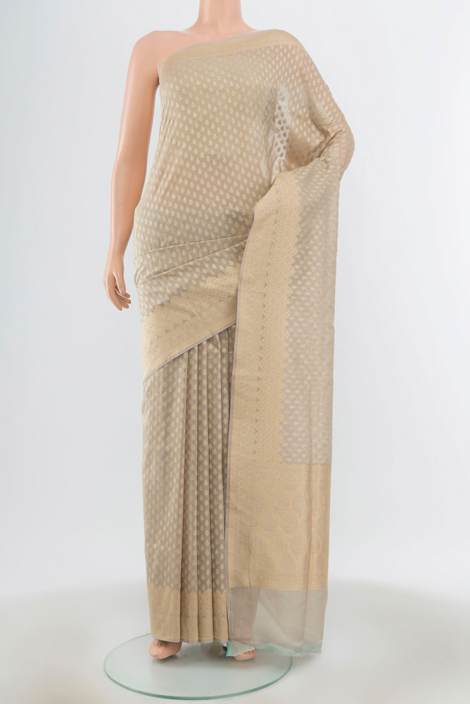 Lilac Banarasi Silk Saree with Zari Butta on the body and Silk Border.  displayed on a mannequin