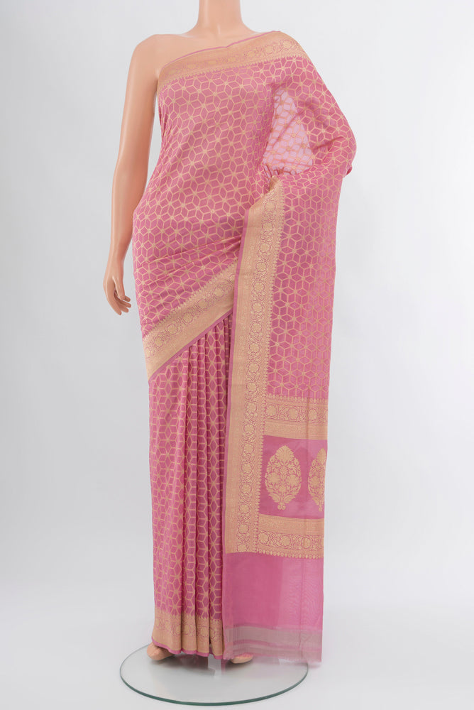 Rose Gold Banarasi Silk Saree with Zari Butta on the body and Silk Border.  displayed on a mannequin