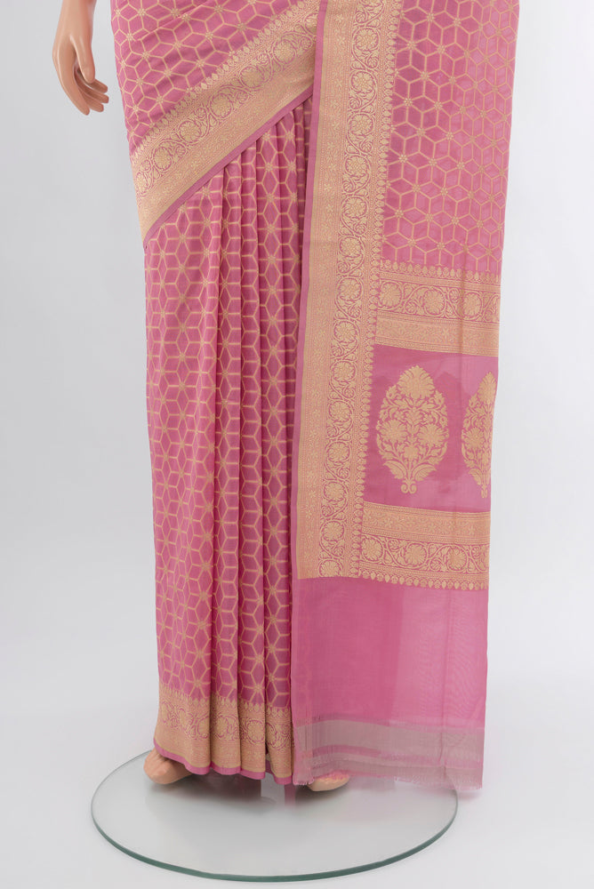 Pleats and pallu of Rose Gold Banarasi Silk Saree with Zari Butta on the body and Silk Border. 