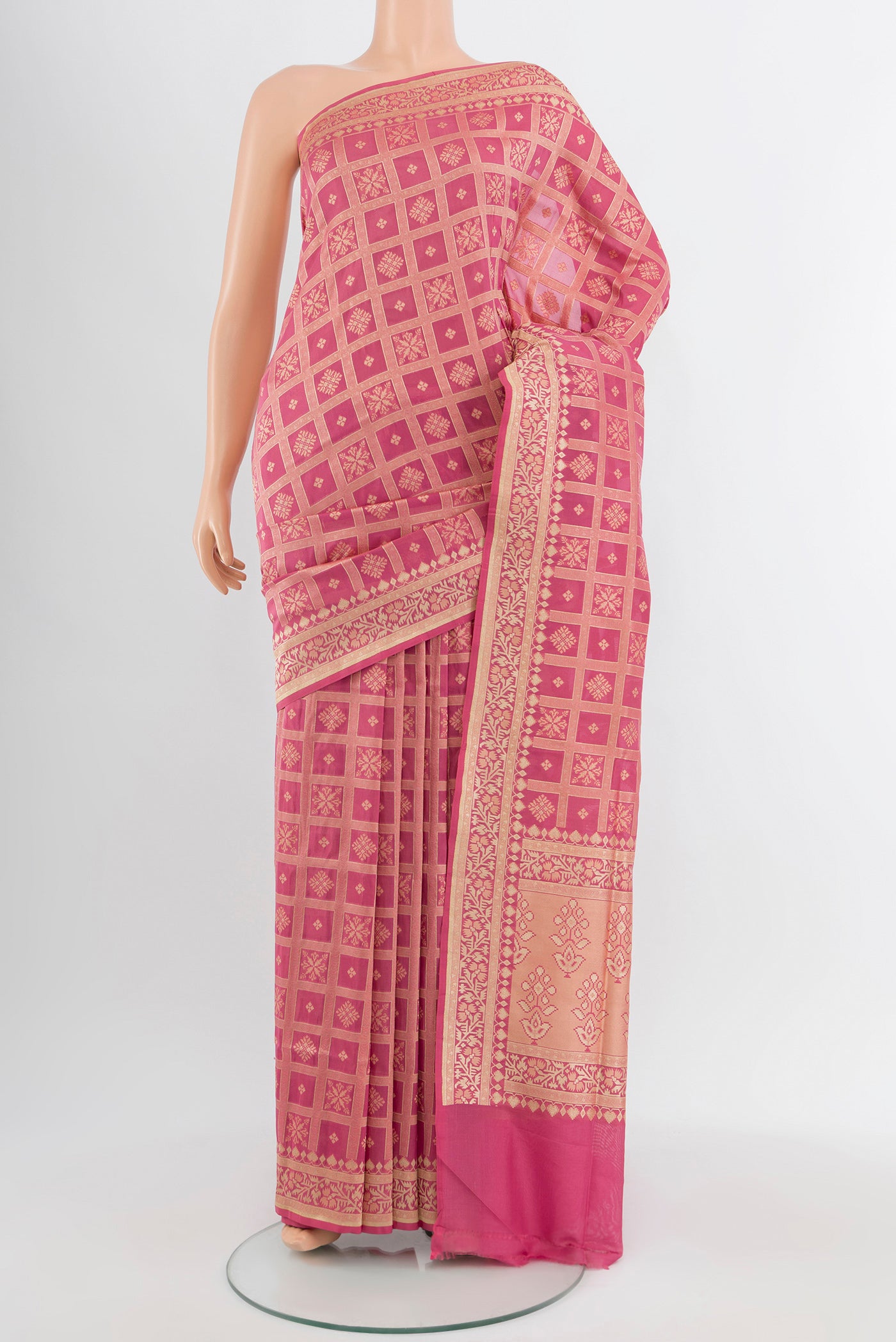 Bronze Banarasi Silk Saree with Zari Butta on the body and Silk Border.  displayed on a mannequin
