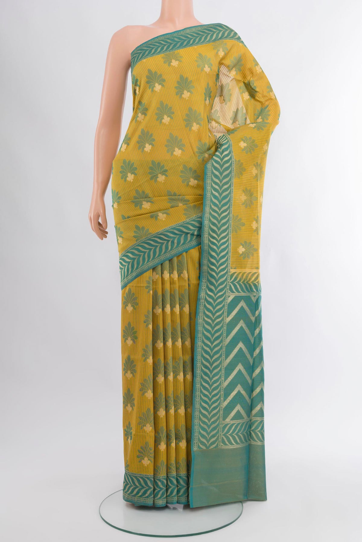 Yellow Banarasi Silk Saree with Zari And Thread Butta on the body and Zari Border.  displayed on a mannequin